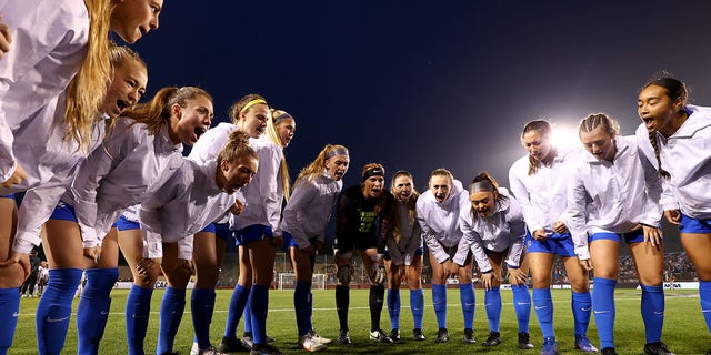 The BYU Cougars get pumped up to take on the Florida State Seminoles in the Division I women's soccer championship at Stevens Stadium in Santa Clara, Calif., on Dec. 6, 2021.