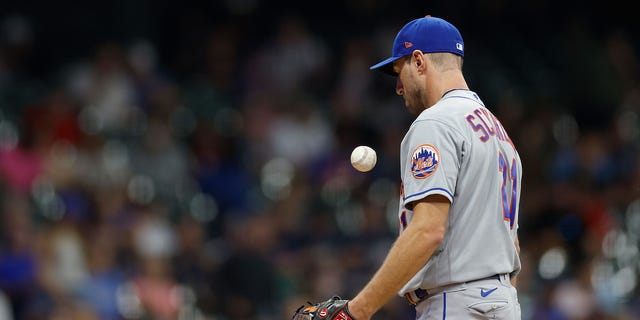 Max Scherzer #21 of the New York Mets flips the ball into the air while taking the mound in the fifth inning against the Milwaukee Brewers at American Family Field on September 19, 2022 in Milwaukee, Wisconsin.