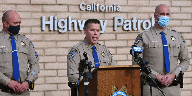 California Highway Patrol Captain Kevin Clays, center, updates the media about a fatal crash in Coalinga, California, on Jan. 2, 2021. The drunk driver collided head-on with a pickup truck which killed both adult drivers and seven kids.