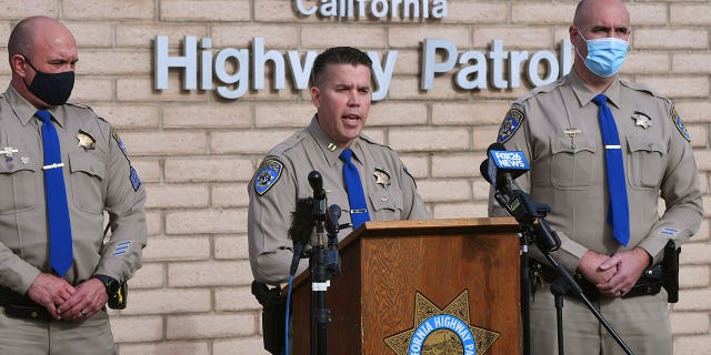 California Highway Patrol Captain Kevin Clays, center, updates the media about a fatal crash in Coalinga, California, on Jan. 2, 2021. The drunk driver collided head-on with a pickup truck which killed both adult drivers and seven kids.