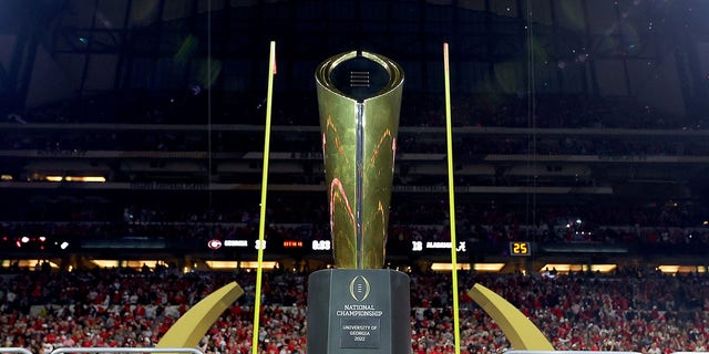 The national championship trophy is displayed after the Georgia Bulldogs defeated the Alabama Crimson Tide 33-18 in the 2022 CFP national championship Game at Lucas Oil Stadium Jan. 10, 2022, in Indianapolis.