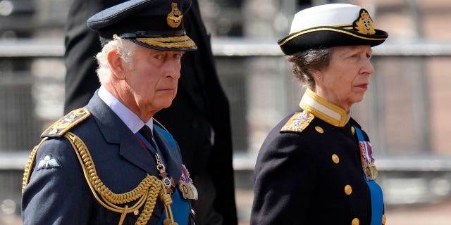 Britain's King Charles III, left, and Princess Anne follow the coffin of Queen Elizabeth II during a procession from Buckingham Palace to Westminster Hall.