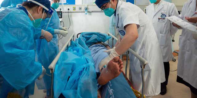 Luo Yong, pictured here in a hospital bed in Chengdu, capital of southwest China's Sichuan Province, on Sept. 21, 2022, after surviving 17 days in the mountains with limited food and water.