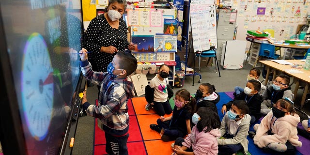 California Gov. Gavin Newsom vetoed the mandatory kindergarten law on Sept. 25, 2022. Pictured: Kindergarten teacher Ana Zavala, left, instructs students at Washington Elementary School in Lynwood, California, on Jan. 12, 2022.