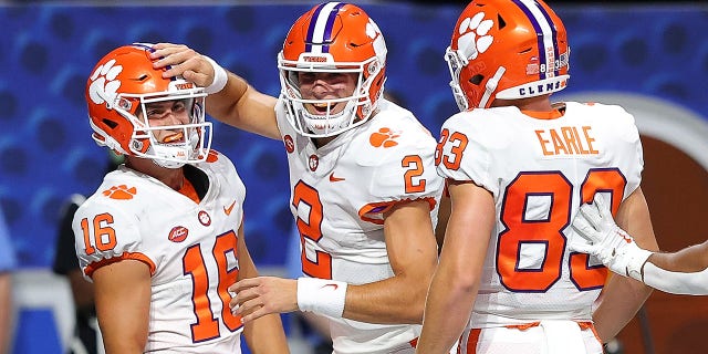 Cade Klubnik #2 of the Clemson Tigers celebrates a touchdown pass to Will Taylor #16 against the Georgia Tech Yellow Jackets in the fourth quarter on Sept. 5, 2022 at Mercedes-Benz Stadium in Atlanta, GA. 