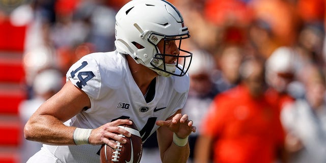 Penn State quarterback Sean Clifford scrambles for yardage during the first half of an NCAA college football game against Auburn, Saturday, Sept. 17, 2022, in Auburn, Ala.