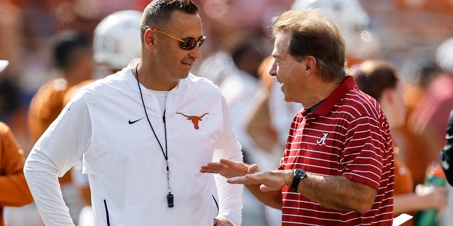 Texas Longhorns head coach Steve Sarkisian talks to Alabama Crimson Tide head coach Nick Saban before a game at Darrell K Royal-Texas Memorial Stadium in September. October 10, 2022 in Austin, Texas.