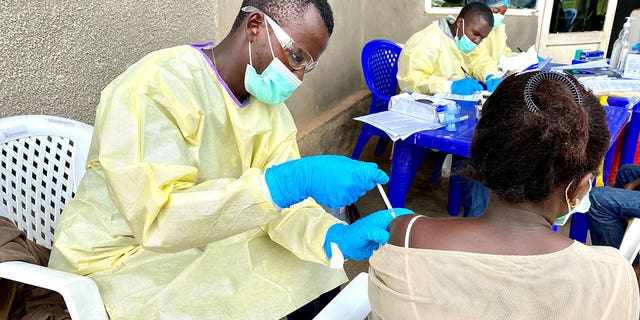 A medical worker vaccinates a resident against the Ebola virus in North Kivu province, northeast of Democratic Republic of the Congo, on March 21, 2021. 