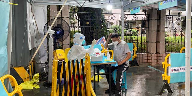 A pop-up COVID testing site can be seen here testing people for COVID in Shenzhen, Guangdong province, China, on Aug. 31, 2022, as COVID cases rise in the area.