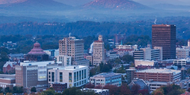 A dawn view of the skyline in Asheville, North Carolina, which has seen rising trends of violent crime in recent years.