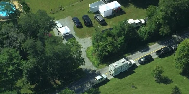 An aerial image of Pennsylvania authorities searching a property possibly related to the Amanda DeGuio missing persons case. 