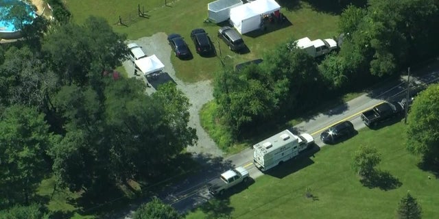 An aerial image of Pennsylvania authorities searching a property possibly related to the Amanda DeGuio missing persons case.