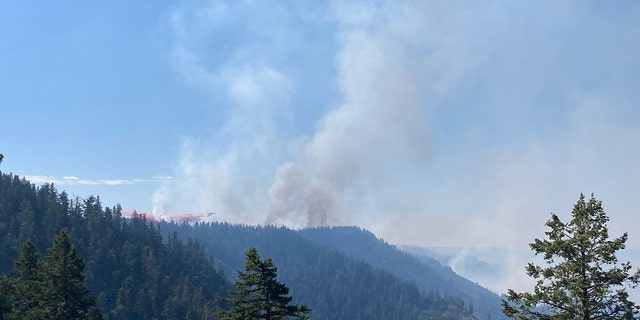 About 300 firefighters along with air tankers and water-dropping helicopters have responded to the growing wildfire. 