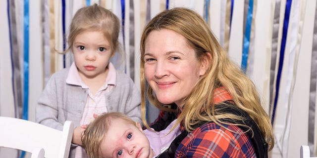Drew Barrymore, Olive Barrymore Kopelman and Frankie Barrymore Kopelman attend Baby2Baby Holiday Party Presented By The Honest Company on Dec. 13, 2014 in Los Angeles. 