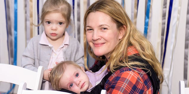 Drew Barrymore, Olive Barrymore Kopelman and Frankie Barrymore Kopelman attend Baby2Baby Holiday Party Presented By The Honest Company on Dec. 13, 2014 in Los Angeles. 