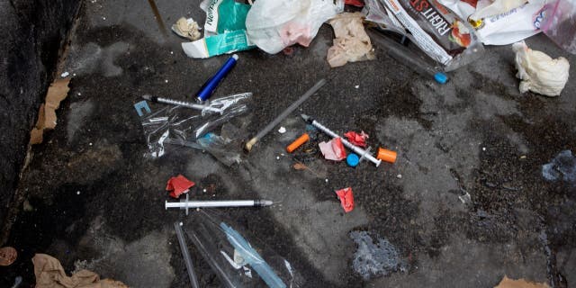 Used needles are seen on the street during a city sweep of a homeless encampment, September 22, 2022 in New York City, New York