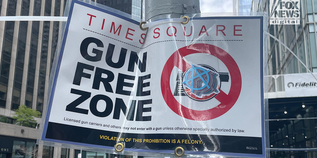 read the signs "gun free zone" Located in the Manhattan borough of New York City. 