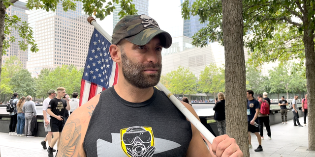 Army veteran Earl Granville is shown holding the American flag after running the annual Tunnel to Towers 5K in New York City on Sunday, Sept. 25, 2022.