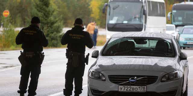 Finnish border agents guard the Russian border in Virolahti, Finland, on Sept. 30, 2022, amid an EU crackdown on visas for Russian citizens.