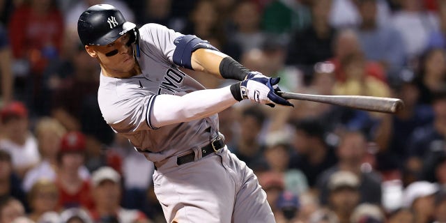 Aaron Judge of the New York Yankees hits a home run against the Red Sox at Fenway Park on September 13, 2022 in Boston.