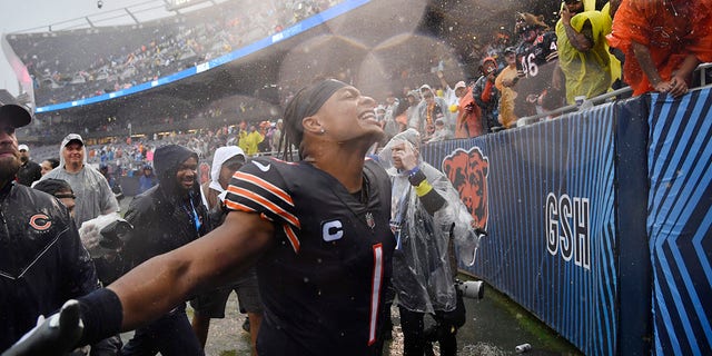 Quarterback Justin Fields of the Chicago Bears celebrates with fans after his team's 19-10 win against the San Francisco 49ers on Sept. 11, 2022.