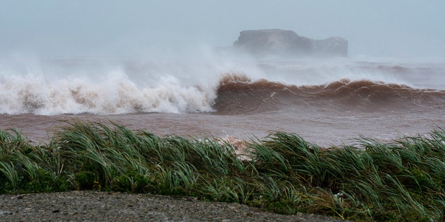 Waves coming ashore at l'Étang-du-Nord caused by post-tropical storm Fiona are shown on the Les Îles-de-la-Madeleine, Que., on Saturday.