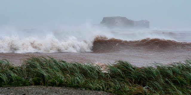 Waves coming ashore at l'Étang-du-Nord caused by post-tropical storm Fiona are shown on the Les Îles-de-la-Madeleine, Que., on Saturday.