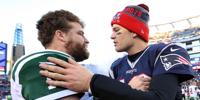 Tom Brady of the New England Patriots, right, talks with Ryan Fitzpatrick of the New York Jets after the Patriots defeated the Jets 41-3 at Gillette Stadium Dec. 24, 2016, in Foxboro, Mass. 