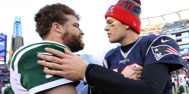 Tom Brady of the New England Patriots, right, talks with Ryan Fitzpatrick of the New York Jets after the Patriots defeated the Jets 41-3 at Gillette Stadium Dec. 24, 2016, in Foxboro, Mass. 