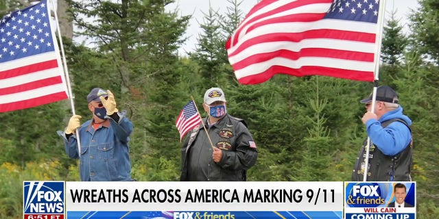 A photo of three men holding American flags shown on "Fox and Friends" on Tuesday, Sept. 6, 2022.
