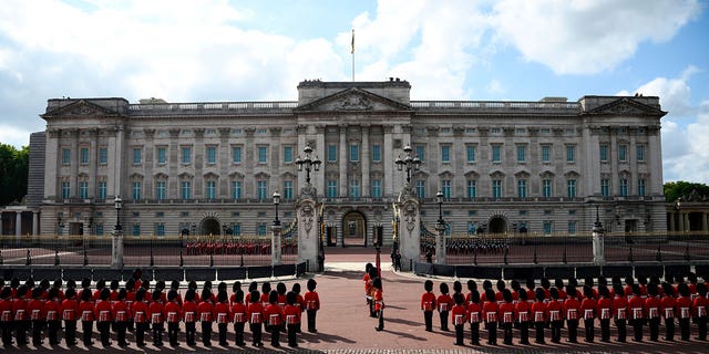 Life Guards, top left, and Blues and Royals, top right, units of the Household Cavalry, and Household Division Foot Guards prepare at Buckingham Palace ahead of a procession of the coffin of Queen Elizabeth II from Buckingham Palace to Westminster Hall. The Queen will lie in state in Westminster Hall for four full days before her funeral on Monday Sept. 19. 