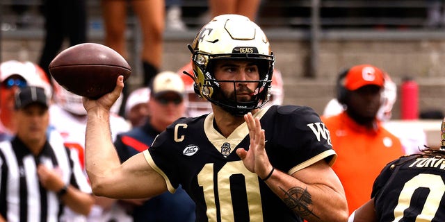 Sam Hartman of the Wake Forest Demon Deacons drops back to pass against the Clemson Tigers during the first half of a game at Truist Field Sept. 24, 2022, in Winston-Salem, N.C.