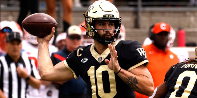 Sam Hartman, #10 of the Wake Forest Demon Deacons, drops back to pass against the Clemson Tigers during the first half of their game at Truist Field on September 24, 2022, in Winston-Salem, North Carolina.