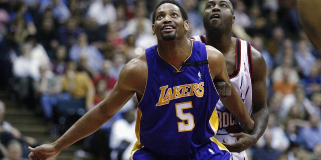 Robert Horry of the Los Angeles Lakers looks up at the ball against the Rockets at Compaq Center on March 26, 2003, in Houston, Texas.