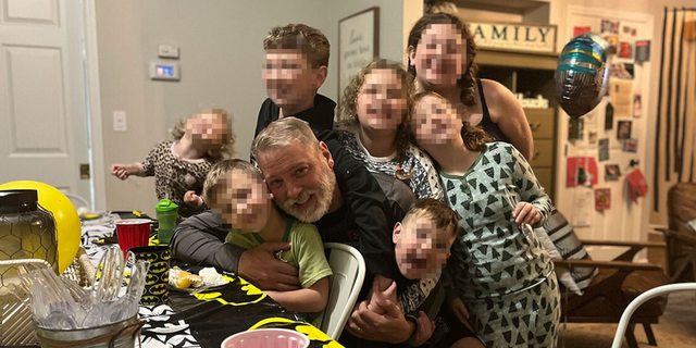 Mark Houck seen with his children. Houck was arrested on Friday by the FBI stemming from a reported altercation with a man outside of a Planned Parenthood in Philadelphia. 