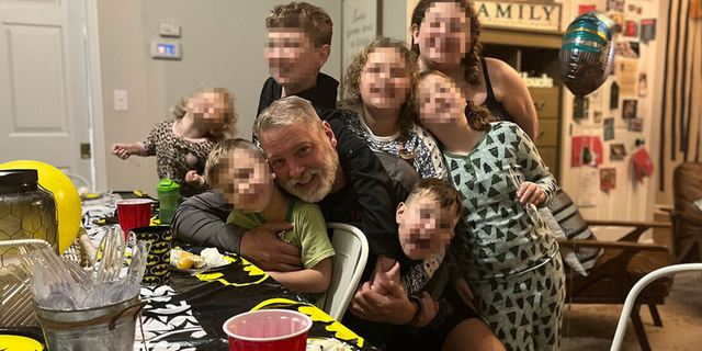 Mark Houck seen with his children. Houck was arrested on Friday by the FBI stemming from a reported altercation with a man outside of a Planned Parenthood in Philadelphia. 