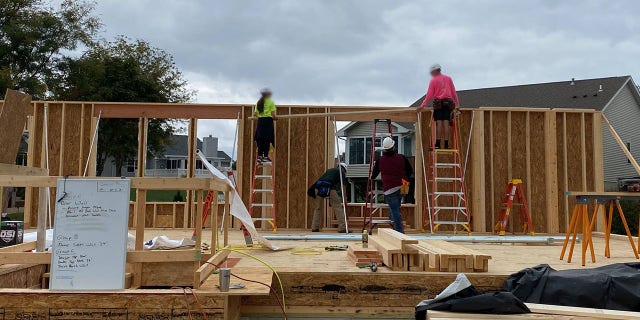 CTE students are shown building a house in Cedar Rapids, Iowa. The profits from the sale of the home go toward next year's home build.