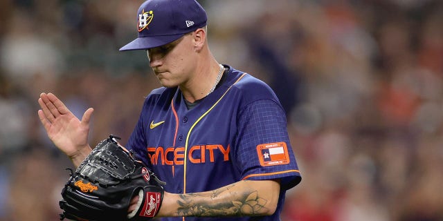 On September 5, 2022 at Minute Maid Park in Houston, Texas, Hunter Brown #58 of the Houston Astros reacts to a strikeout by Bubba Thompson #65 of the Texas Rangers, with two men on base.