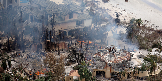 A home burns after Hurricane Ian passed through the area on September 29, 2022 in Sanibel, Florida. The hurricane brought high winds, storm surge and rain to the area causing severe damage. (Photo by Joe Raedle/Getty Images)