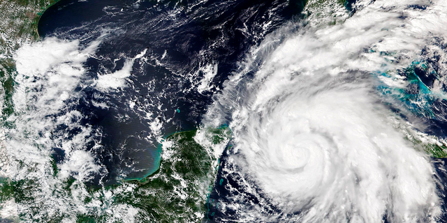 This Sept. 26, 2022, satellite image released by NASA shows Hurricane Ian growing stronger as it barreled toward Cuba. Ian was forecast to hit the western tip of Cuba as a major hurricane and then become an even stronger Category 4 with top winds of 140 mph (225 km/h) over warm Gulf of Mexico waters before striking Florida.