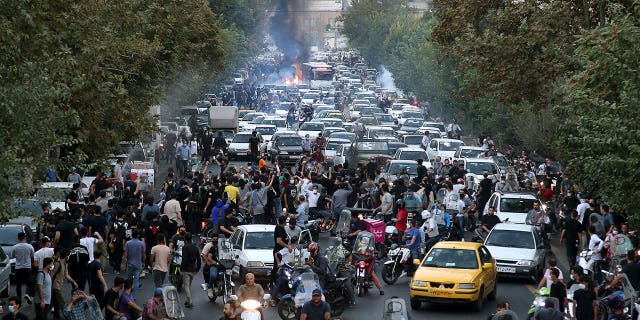 Protesters jam a street in downtown Tehran, Iran, on Wednesday, Sept. 21, 2022.