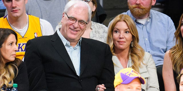 Phil Jackson and Jeanie Buss attend a New York Knicks-Los Angeles Lakers game at Staples Center on March 12, 2015, in Los Angeles.