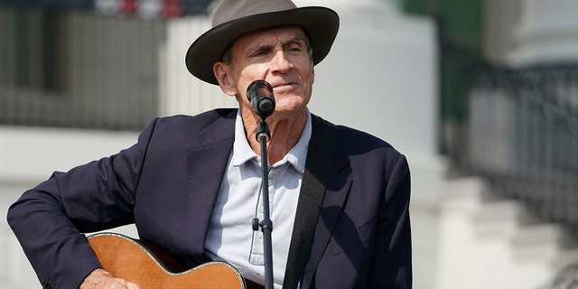 US singer James Taylor performs before US President Joe Biden speaks during an event to celebrate the passage of the Inflation Reduction Act of 2022 on the South Lawn of the White House in Washington, DC, on September 13, 2022. (Photo by Mandel NGAN / AFP) (Photo by MANDEL NGAN/AFP via Getty Images)
