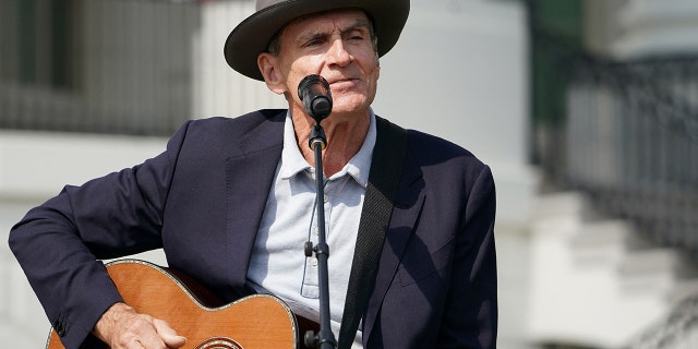 US singer James Taylor performs before US President Joe Biden speaks during an event to celebrate the passage of the Inflation Reduction Act of 2022 on the South Lawn of the White House in Washington, DC, on September 13, 2022. (Photo by Mandel NGAN / AFP) (Photo by MANDEL NGAN/AFP via Getty Images)