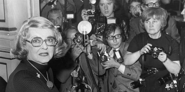 Jane Bown, far right, takes photos at a Bette Davis press conference in 1975. 