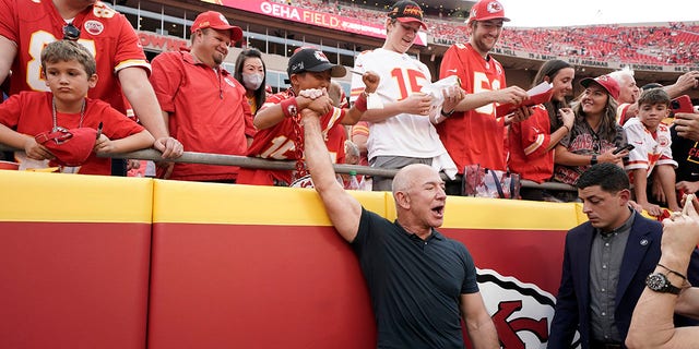 Amazon founder Jeff Bezos greets fans before the start of the game between the Kansas City Chiefs and the Los Angeles Chargers at Arrowhead Stadium in Kansas City, Missouri, on Thursday.