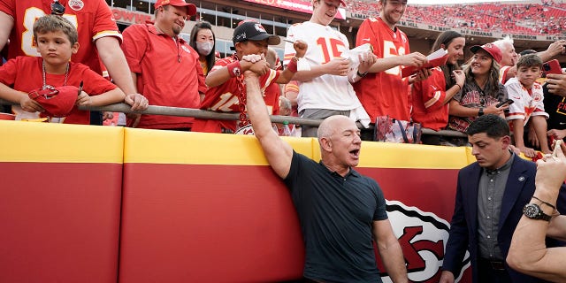 Amazon founder Jeff Bezos greets fans before the start of the game between the Kansas City Chiefs and the Los Angeles Chargers at Arrowhead Stadium in Kansas City, Missouri, on Thursday.