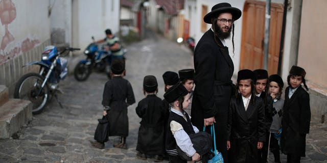 Adult and child members of ultra-orthadox Jewish sect Lev Tahor are seen here in the village of San Juan La Laguna, Mexico, on Aug. 24, 2014, where they are currently being investigated by Mexican authorities for child sex crimes and human trafficking allegations.