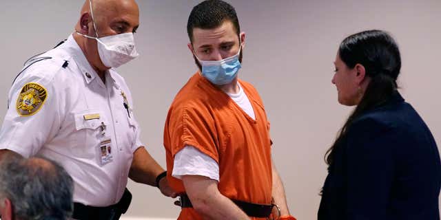 Joseph Stapf, 31, is pictured here being escorted into Hillsborough County Court, Thursday, Sept. 29, 2022, in Nashua, N.H., for a plea hearing where he was sentenced to over 20 years in prison.