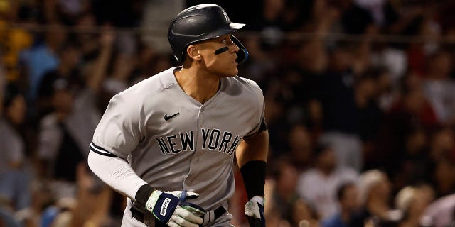 Aaron Judge of the New York Yankees watches a home run against the Boston Red Sox at Fenway Park in Boston on August 12, 2022.